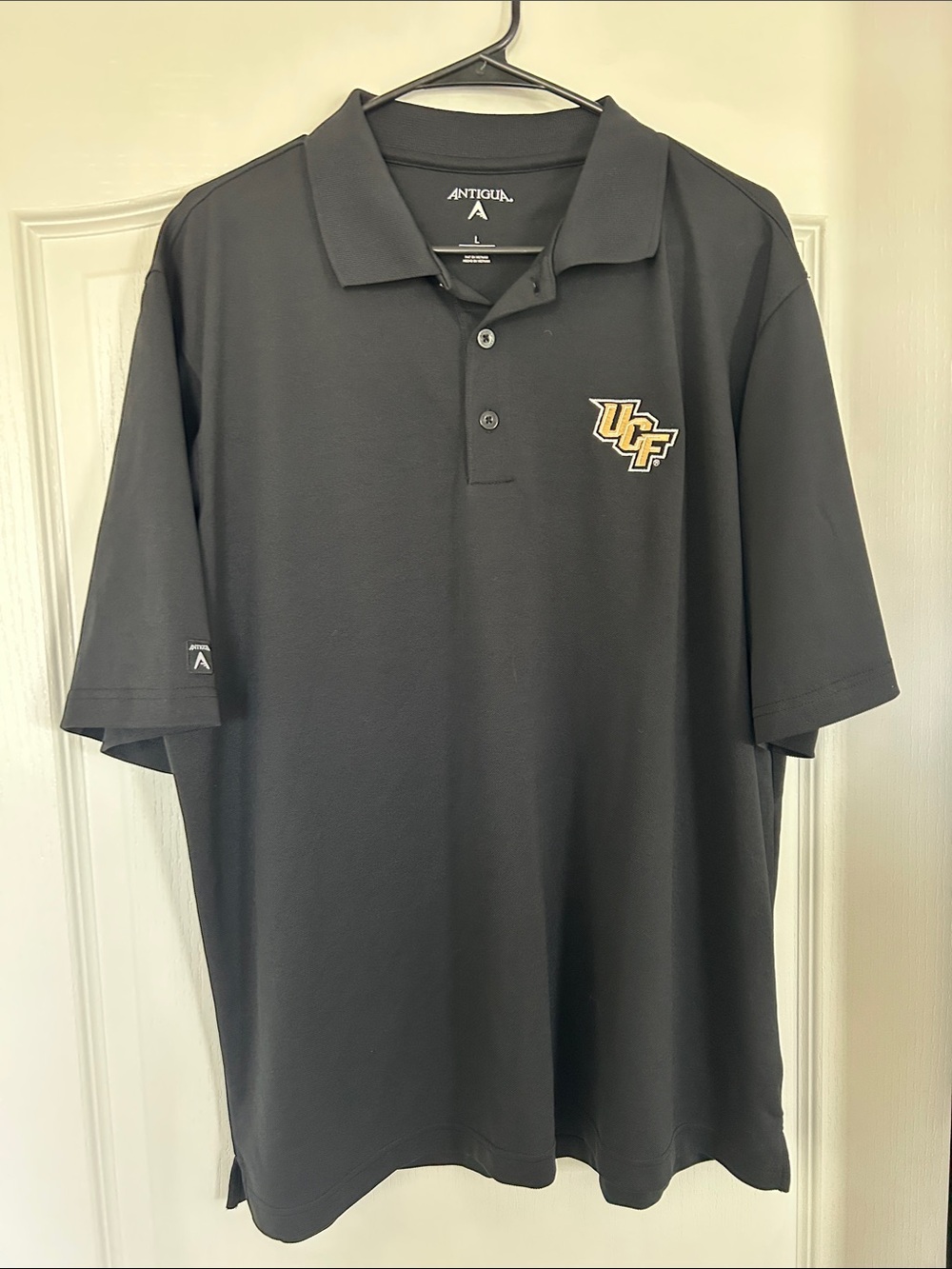 Antigua UCF Black Polo with Gold Logo